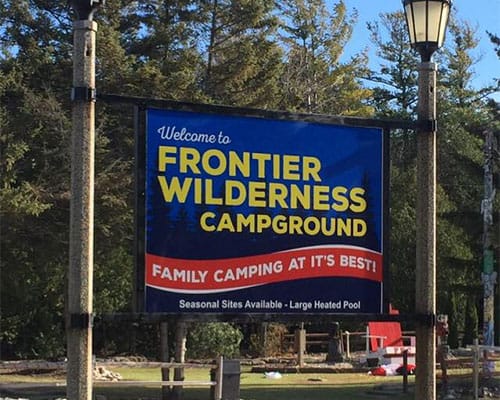 Frontier Wilderness Campground Sign - Egg Harbor Stay
